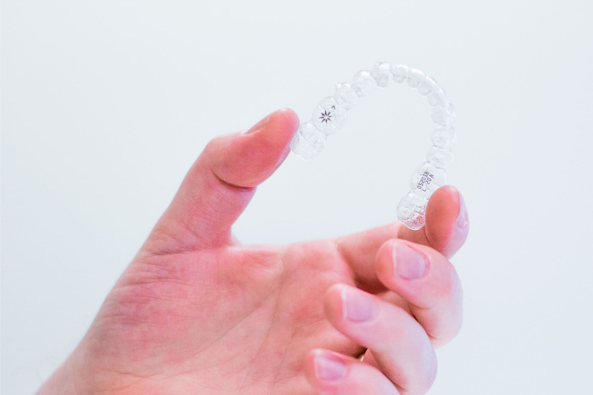 hand-holding-invisalign-aligners Lake Oswego Invisalign